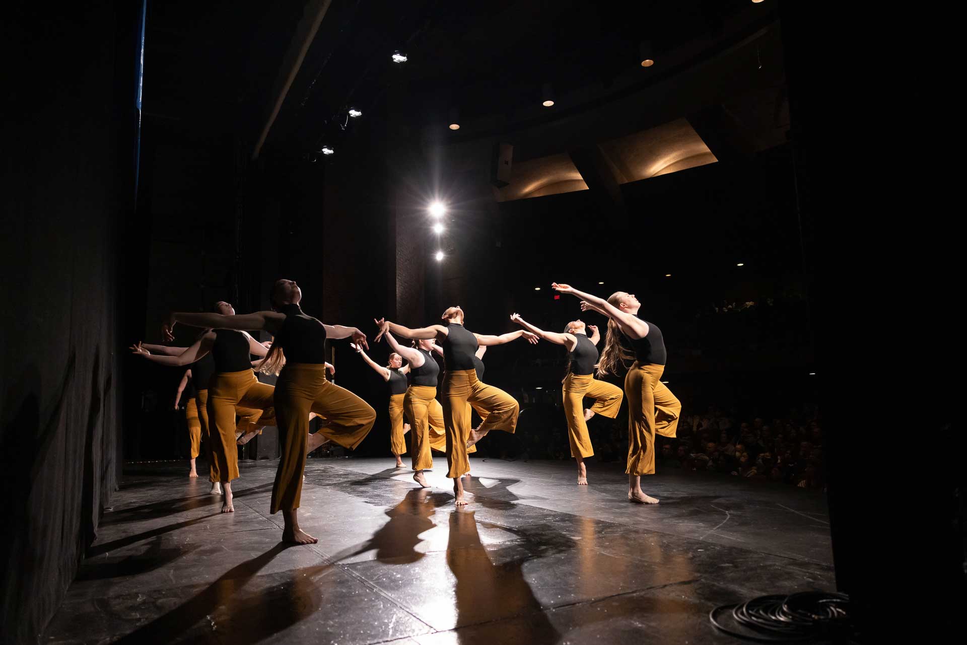 Students dance on stage.