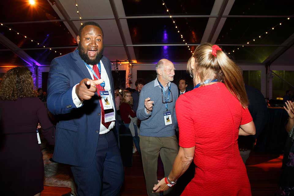 Alumni and faculty members dancing at the Diamond Celebration