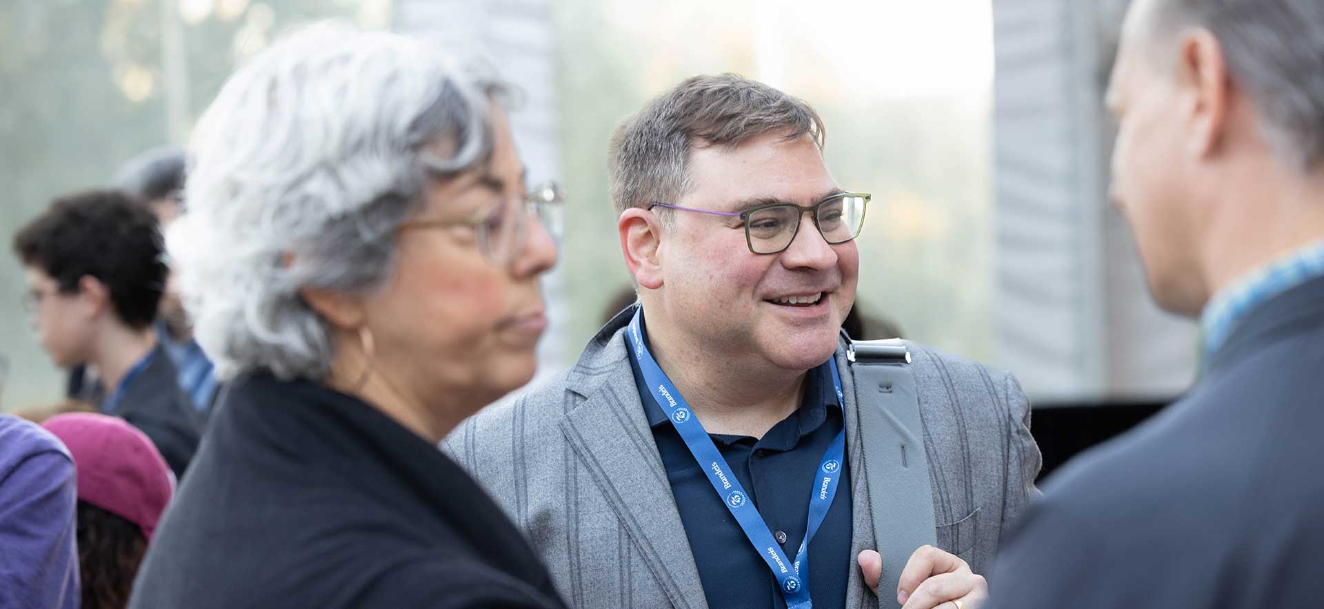 Mark Beatty talks to others at the Welcome Reception