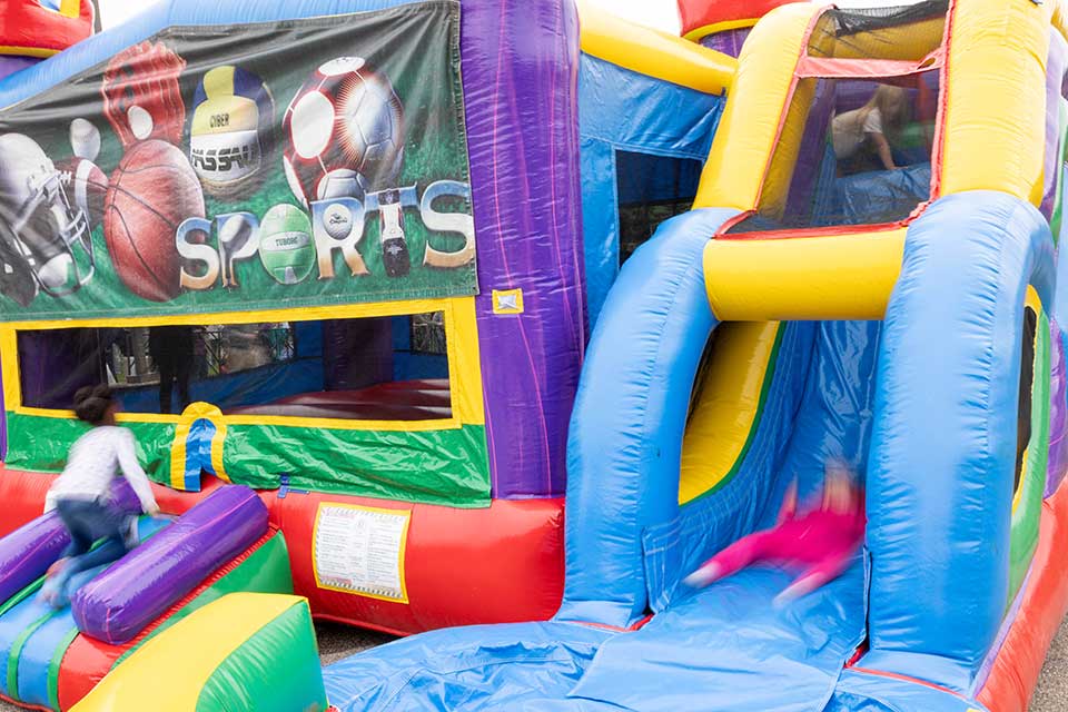 Children enjoy the bouncy house