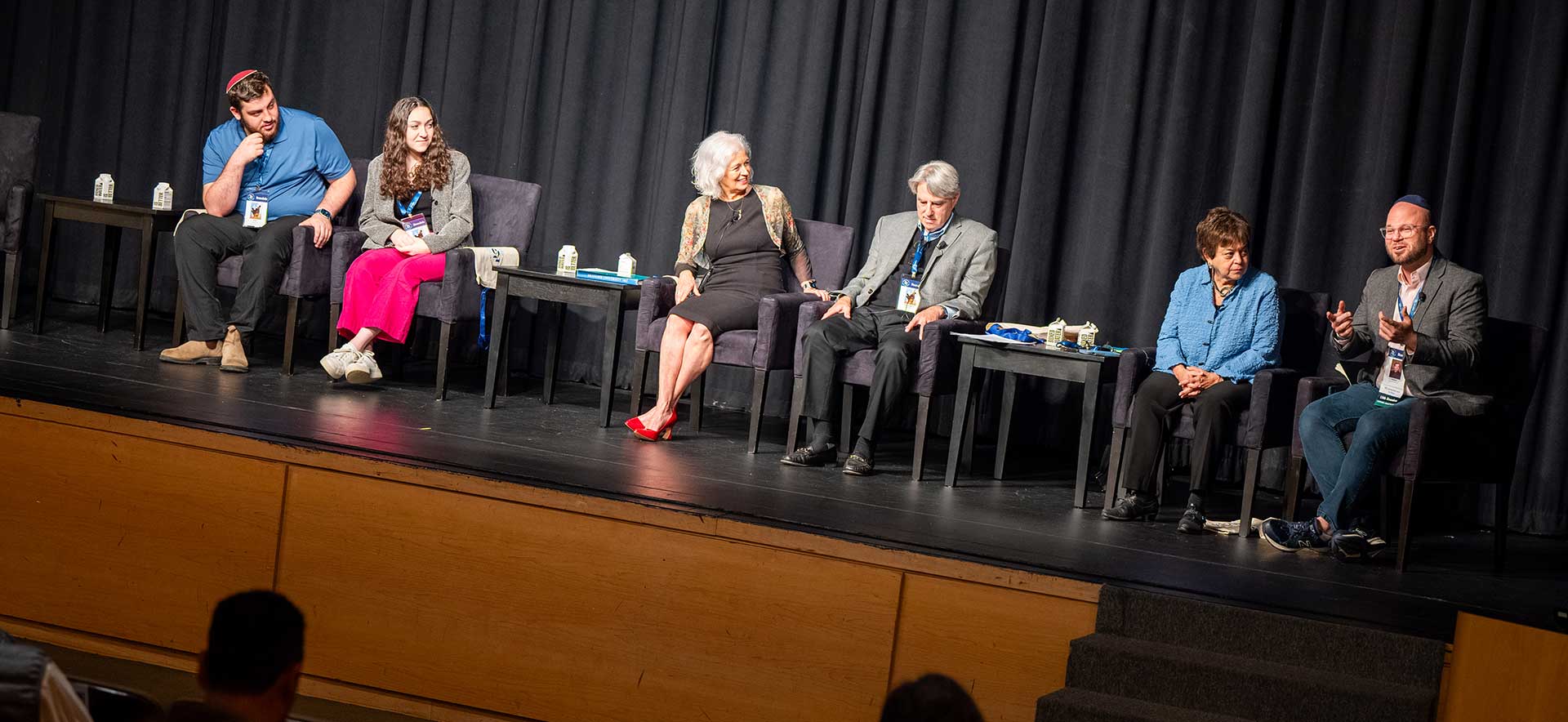 Panelists sitting on a stage