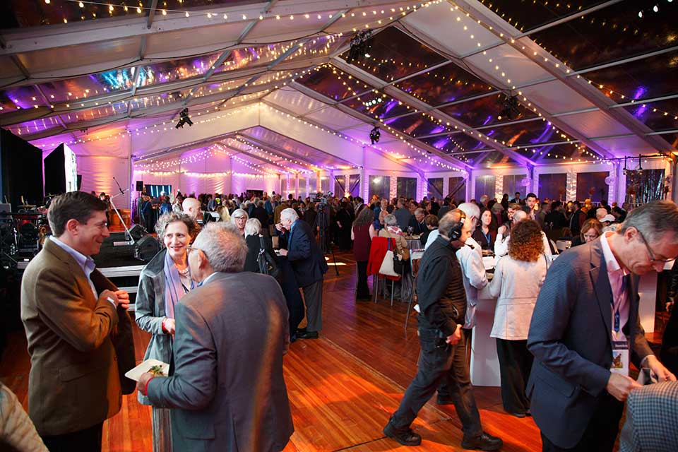 People celebrating inside the gala tent