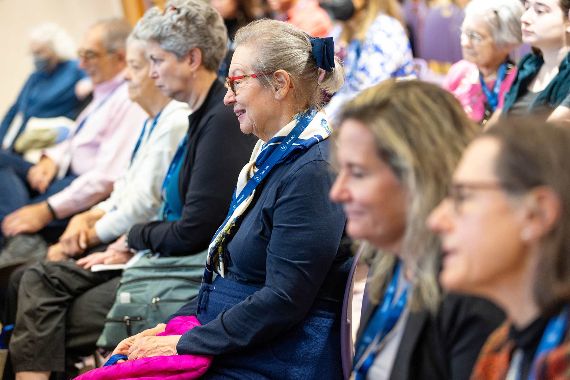 Members of the audience listening to a panel discussion