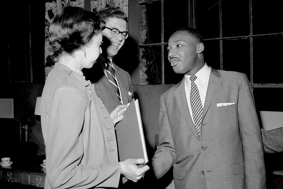Dr. Martin Luther King Jr. talks with students during his visit to campus.