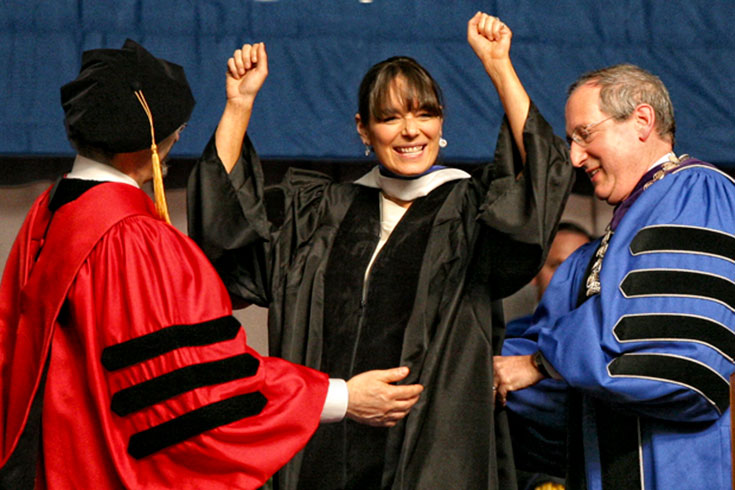 Deborah Bial cheers as she is bestowed an honorary Doctor of Humane Letters