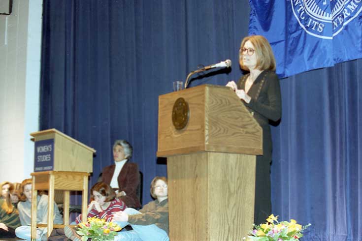Gloria Steinem speaks at a podium