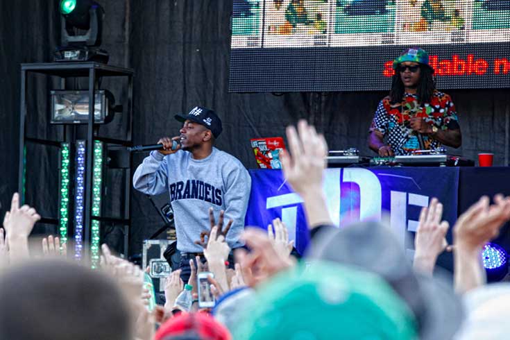 Kendrick Lamar performing in a Brandeis sweatshirt