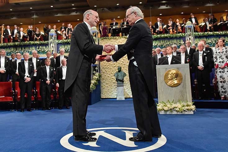 Michael Rosbash receives the Nobel Prize medallion from Swedish King Carl XVI Gustaf