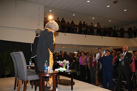 Angela Davis and Julieanna Richardson taking a bow to a standing ovation of applause