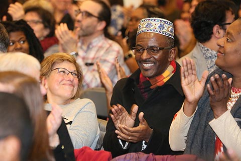 Audience clapping during program