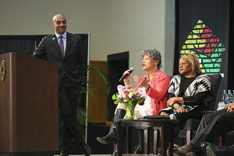 Ford Hall 1969 panelist Hamida Abdal Kallaq '72 speaking.  Patricia Van Story '72 sits to her right.