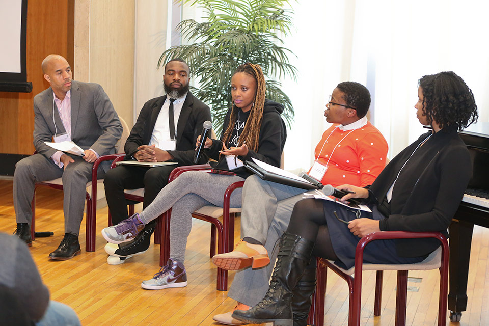 C. Shawn McGuffey, Darnell Moore, Treva Lindsey, Moya Bailey and Aliyyah Abdur-Rahman speaking on stage.