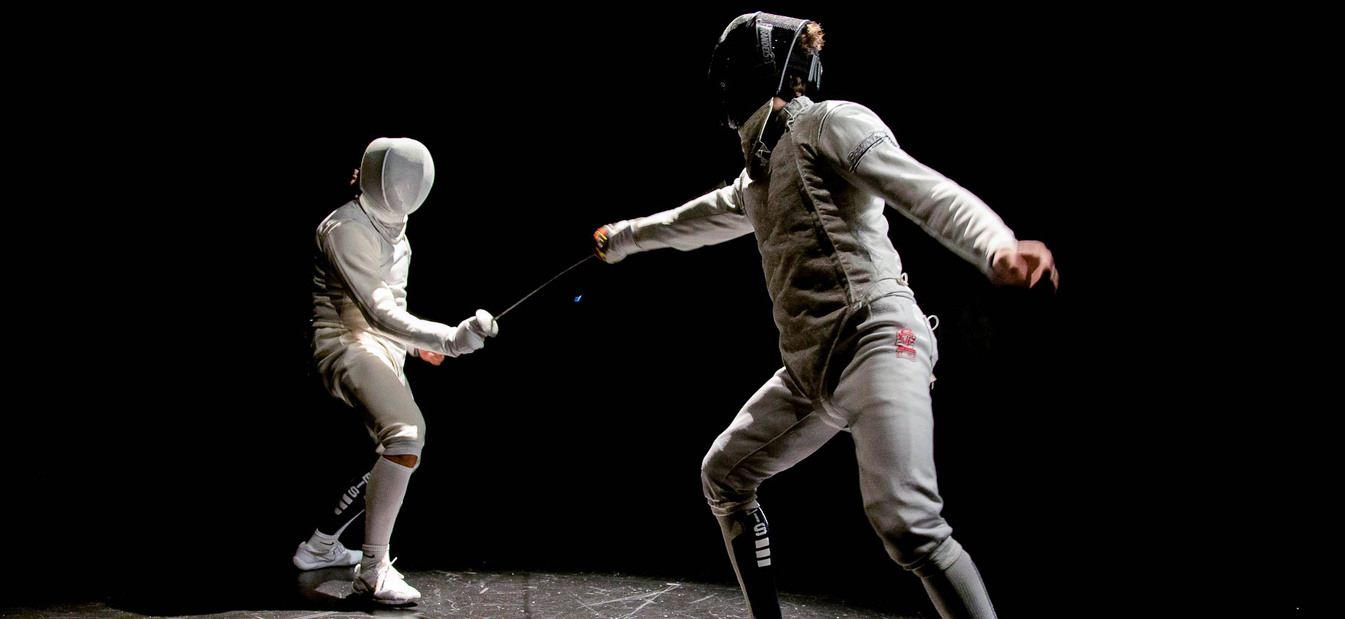 Two fencers in a duel