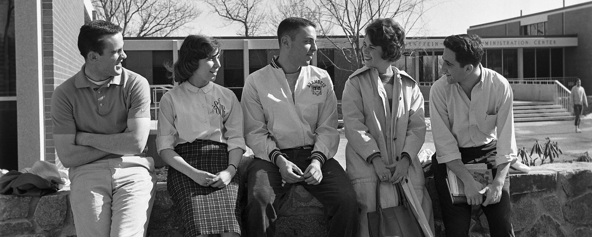 Group of students chatting outside of Bernstein-Marcus Academic Center in the early 1960s