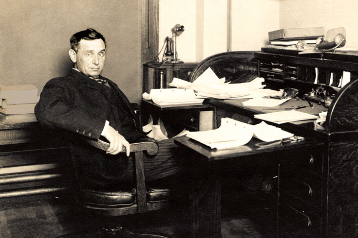 Louis D. Brandeis sits at his desk, circa 1900