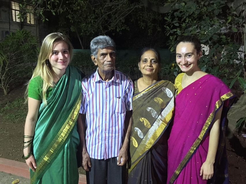 Annie Fortnow with a friend and local family in India