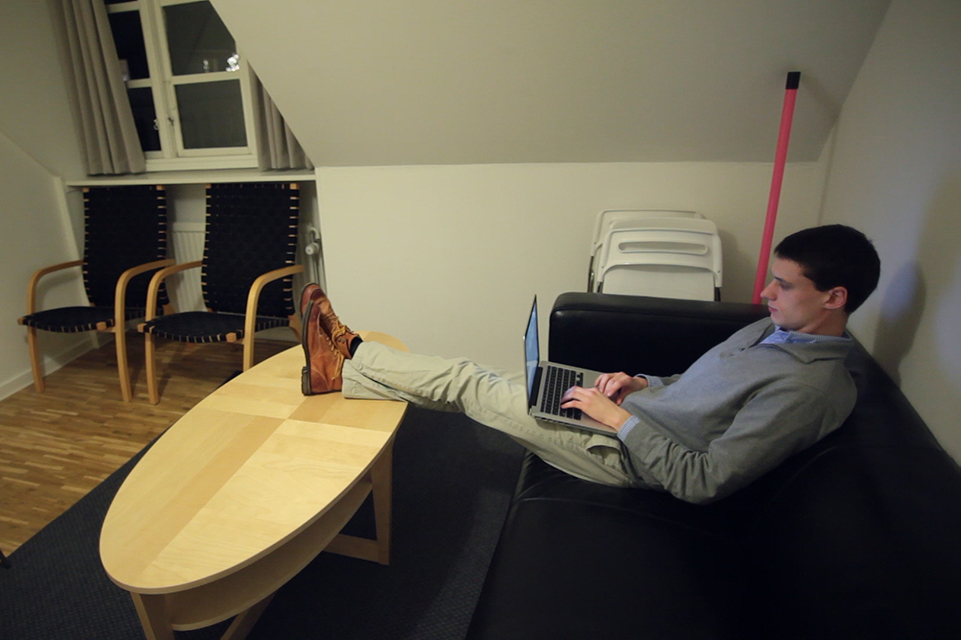 A student works in the lounge in DIS-provided housing