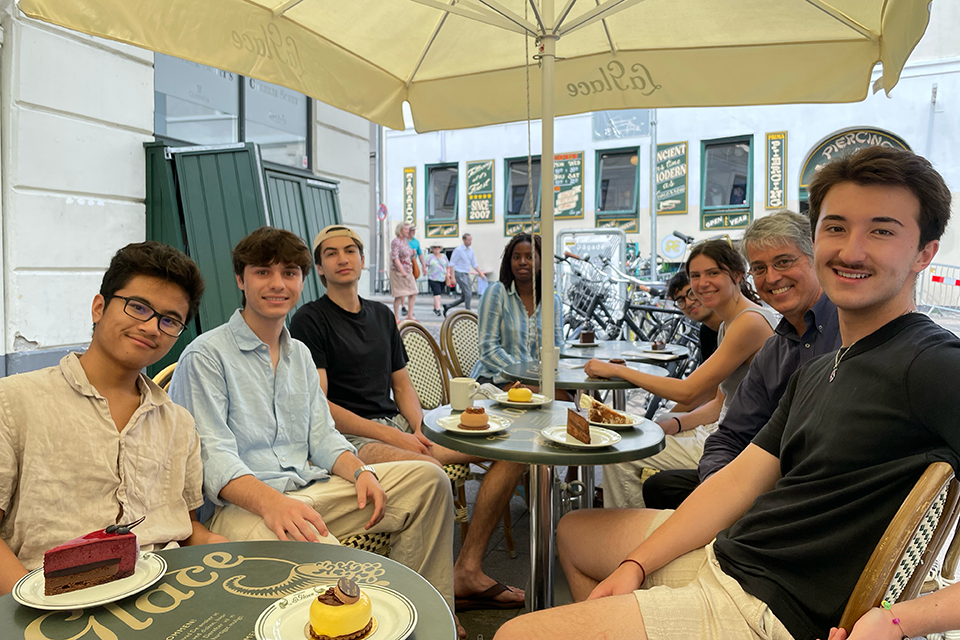 Students sitting around a table outside a cafe in Copenhagen