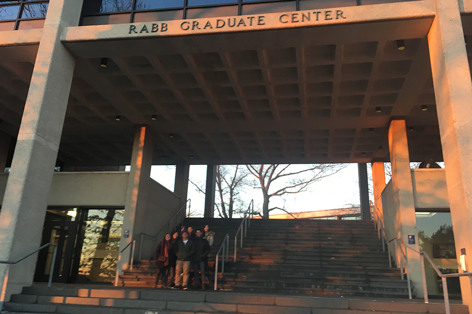 Exchange students standing on Rabb stairs on campus