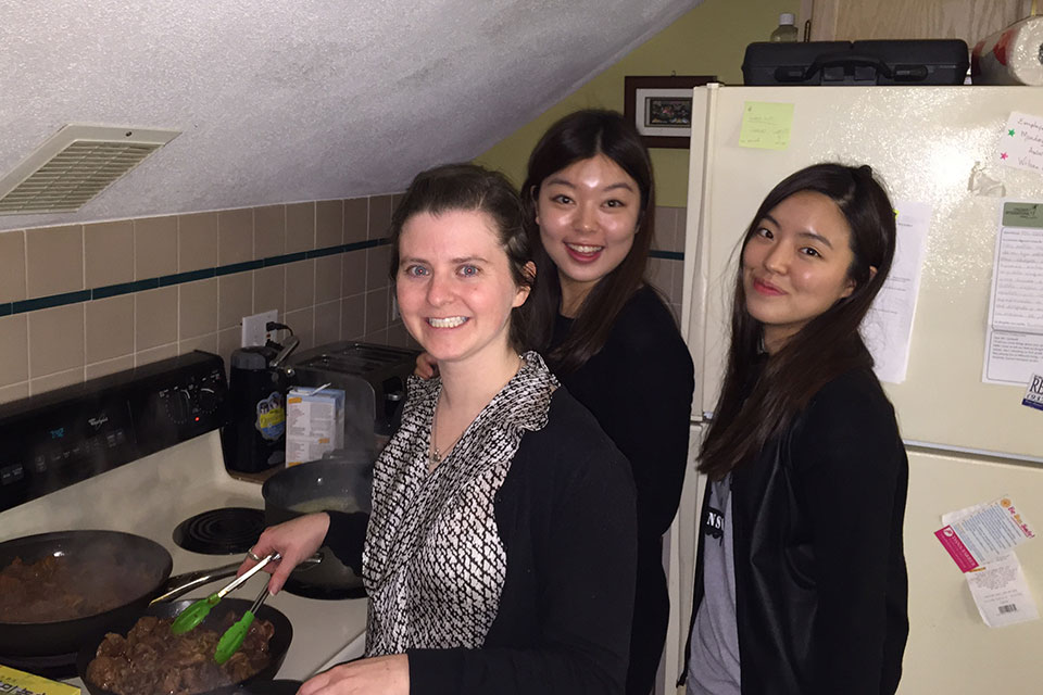 Exchange students and Brandeis staff cooking