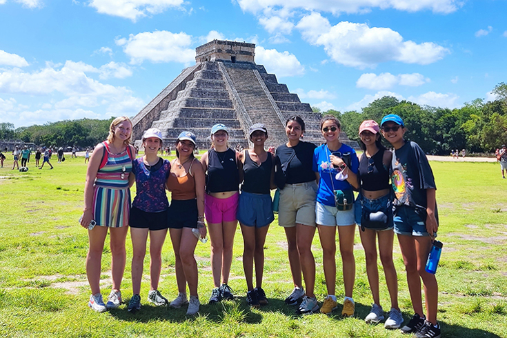Brandeis students in front of a scenic view in Merida, Mexico