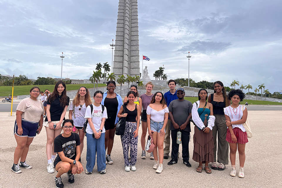 Students pose in front of an historic site in Havana, Cuba