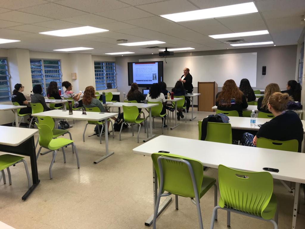 Brandeis students in class with a local faculty member