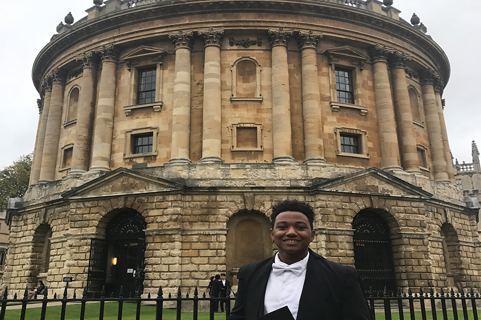 Brandeis student in robes at oxford
