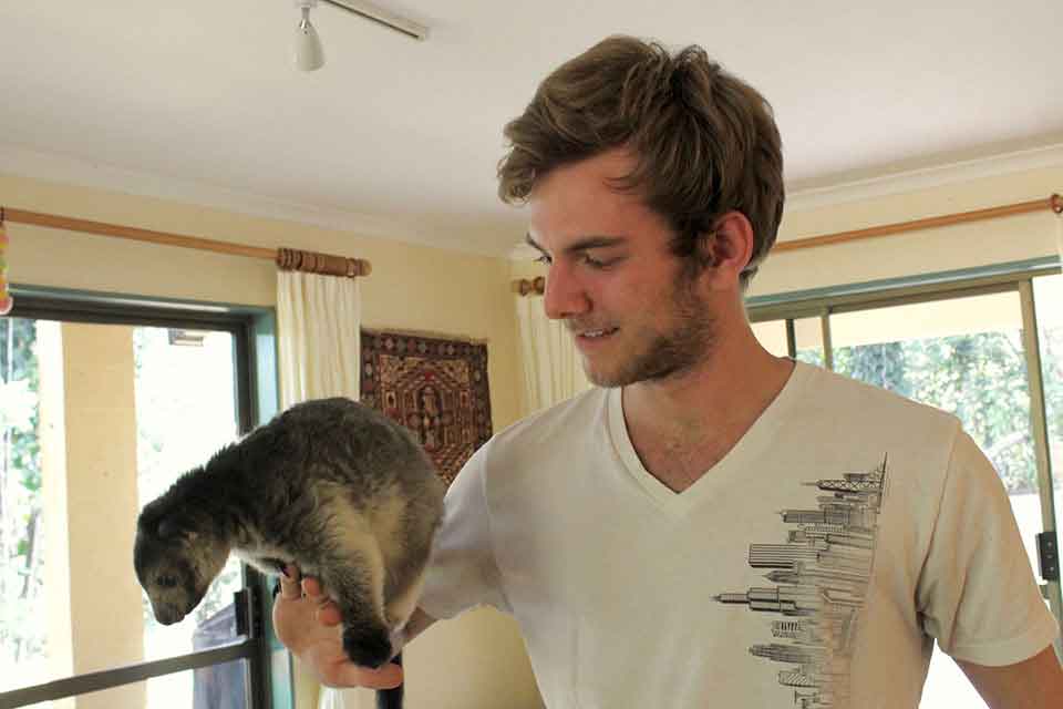 Matt Smetana holds a tree kangaroo