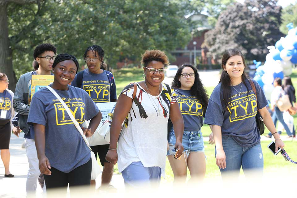 Directory Kathryn Bethea and MKTYP students smiling on campus