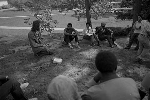 Historical photo of students seating outdoors