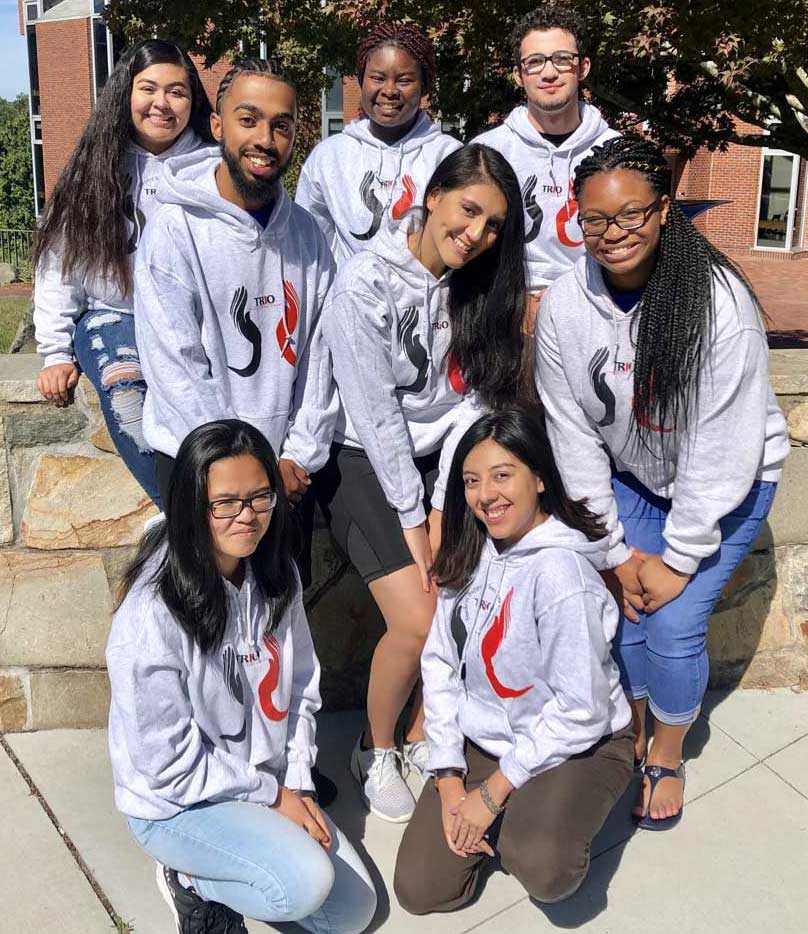 Student leadership group members smiling on campus