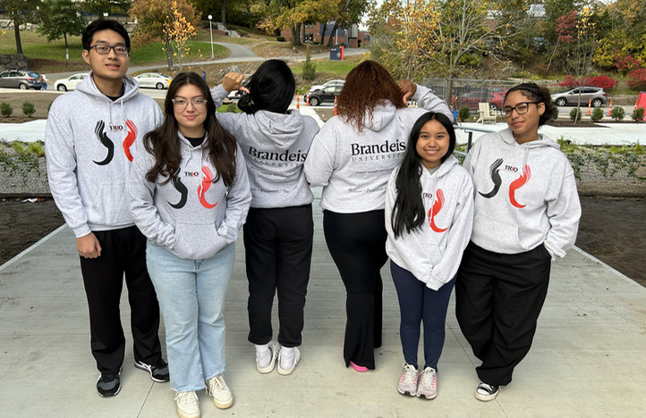 Student leadership group members smiling on campus