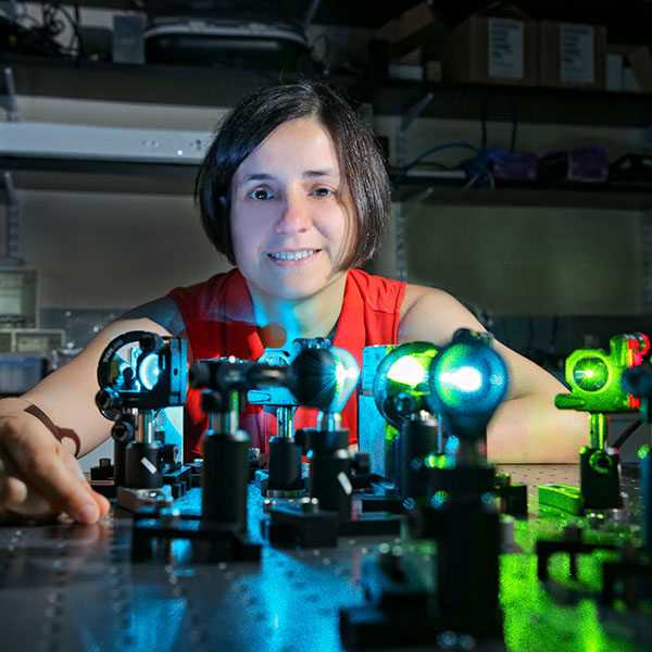 Tijana Ivanovic sits behind lasers on a table