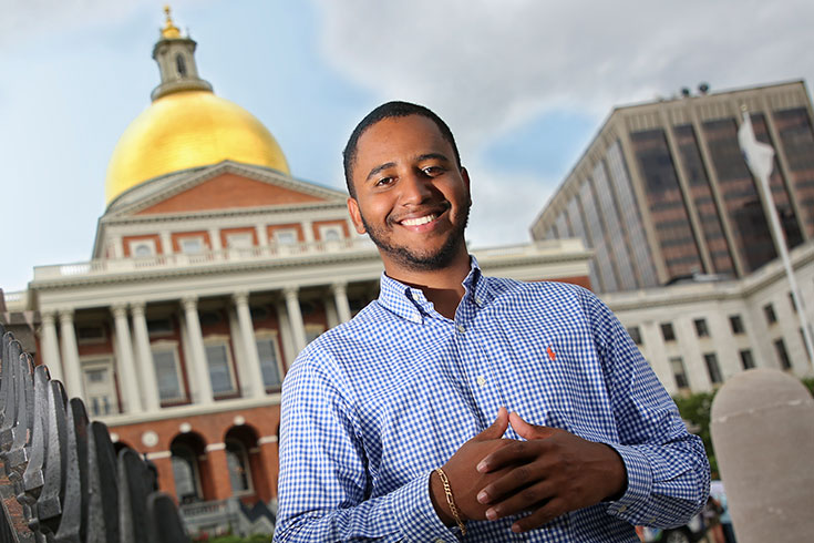 Dario Alves ’21 standing in front of the Massachusetts State House