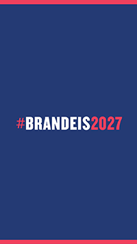 White and pink text on a blue background that reads hashtag Brandeis 2026