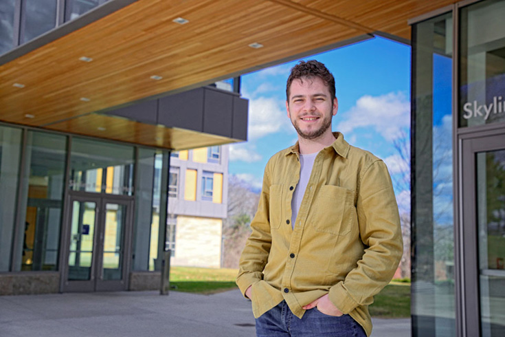 Rafi standing in front of Skyline Residence Hall