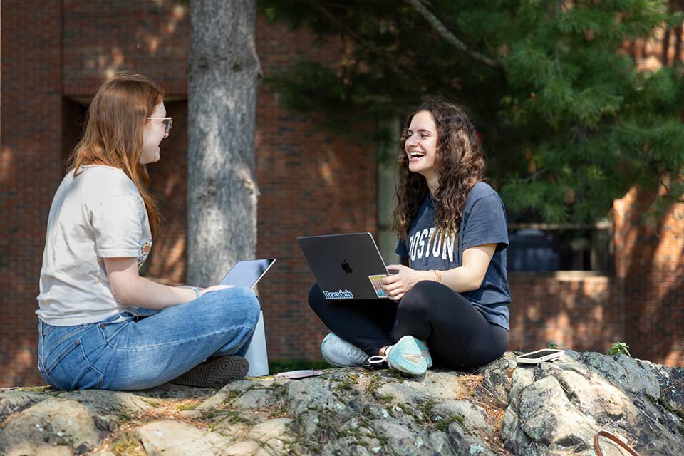 Students seated physically distanced in the study library of the Shapiro Campus Center