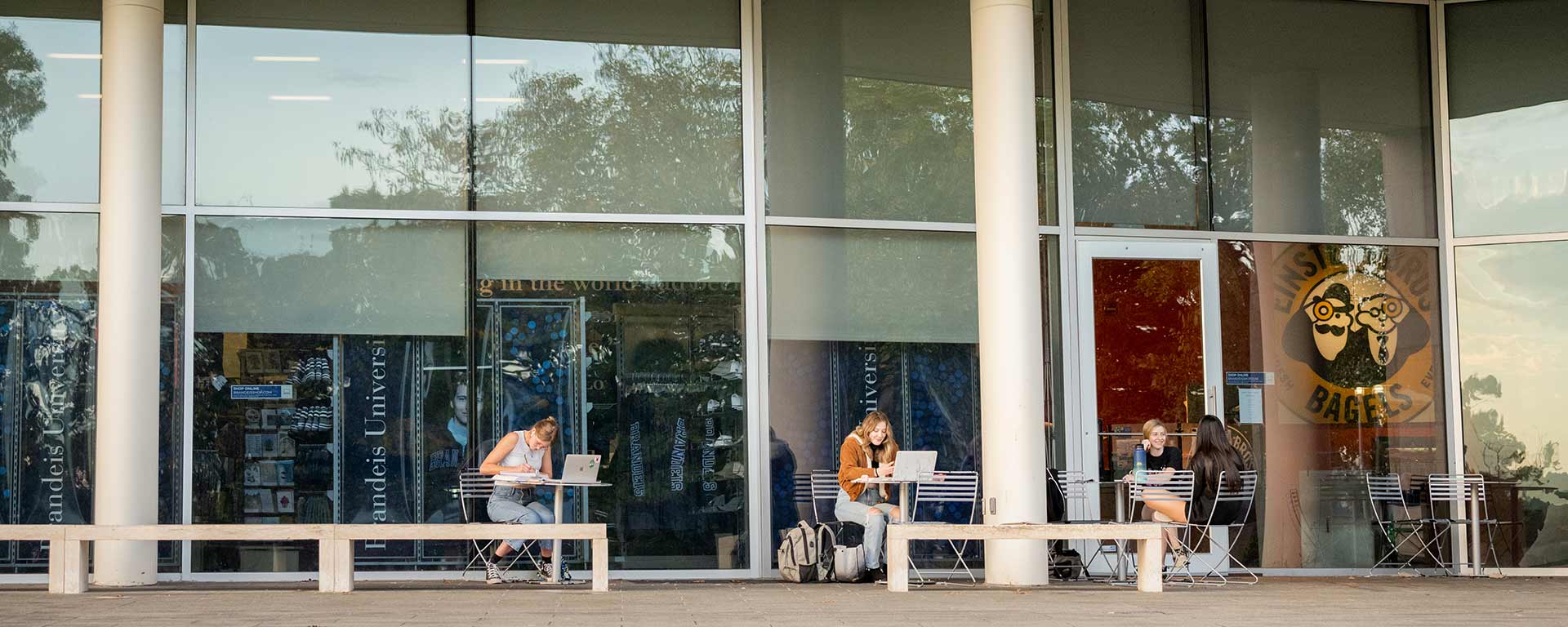 Students walking down the Rabb steps and through campus