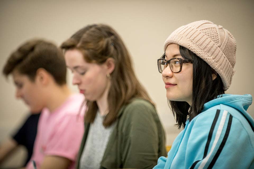 Students looking up in a classroom