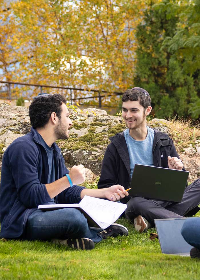 Students walking outside the Humanities building