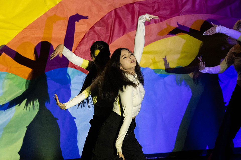 A student dances on stage during Culture X.