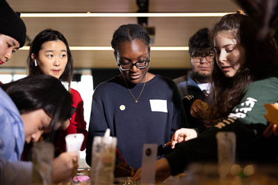 Justine stands with a group of students