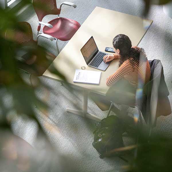 A student works on a laptop