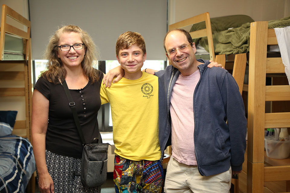 Parents with son in dorm room 