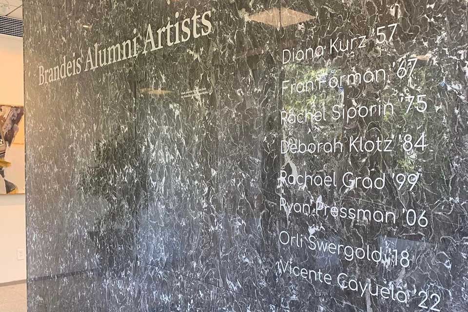 Names of alumni artists on the wall of the alumni art gallery