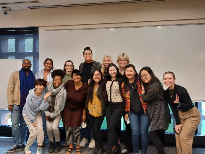 A group of smiling graduate students