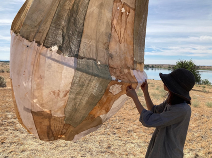 artist assembling sculpture