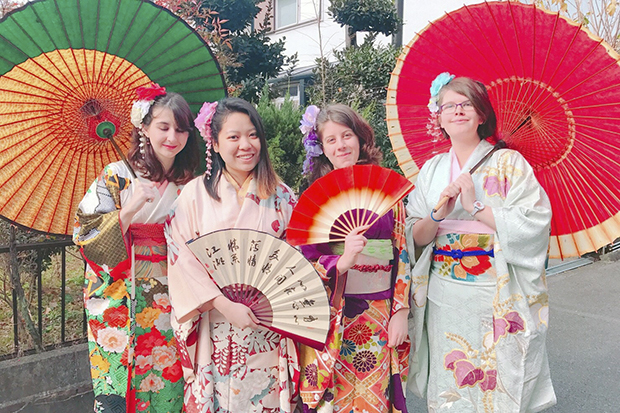 Megan McClory stands with 3 other women in traditional Japanese clothes, in Japan