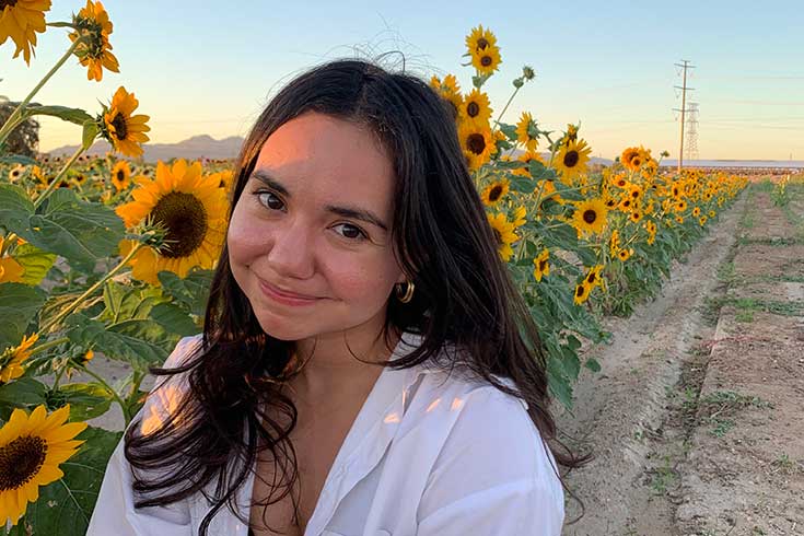 Gabriela Mendoza Cueva in a sunflower field